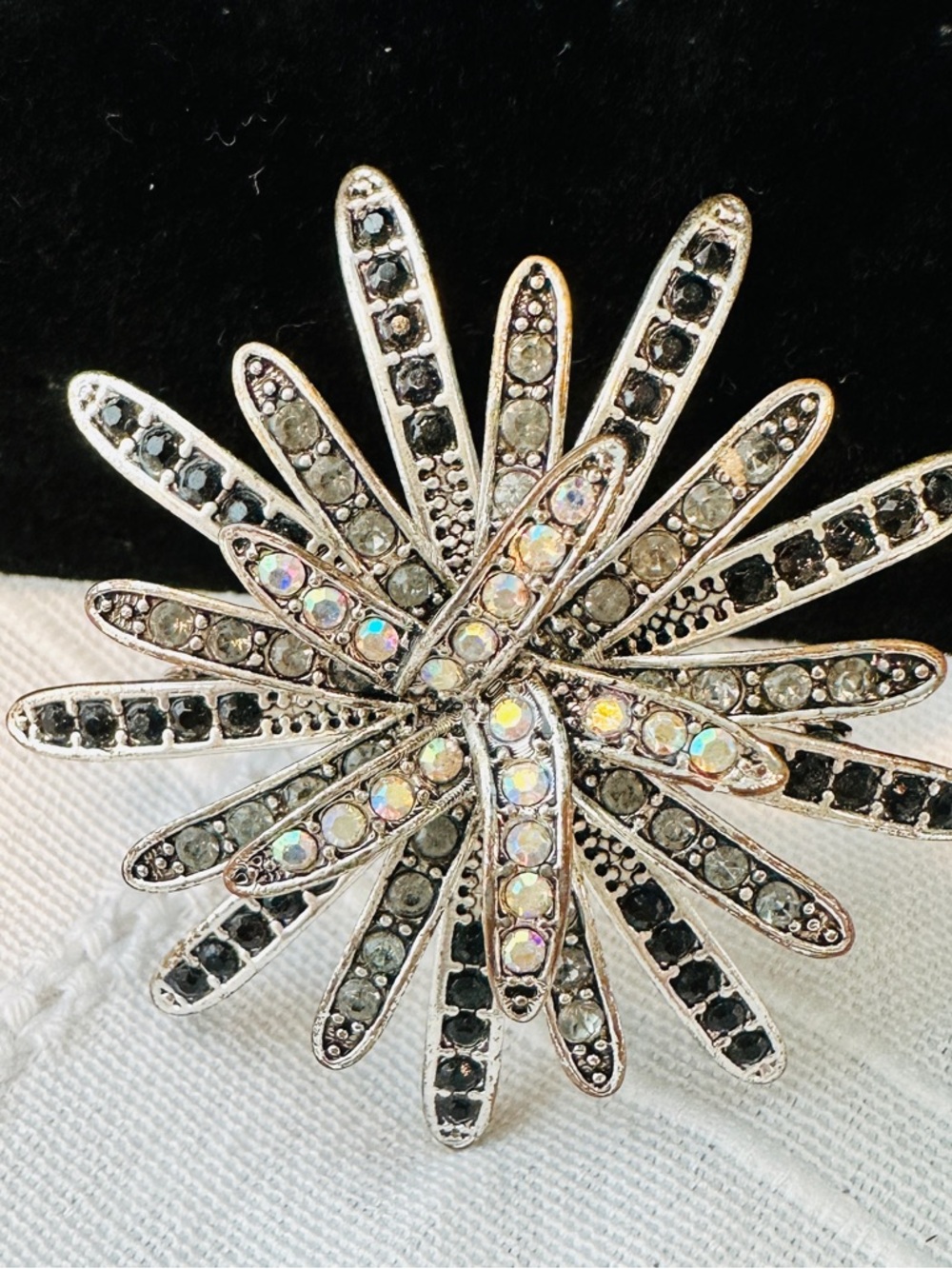 Silver-Tone Starburst Brooch with Black and Iridescent Crystals
